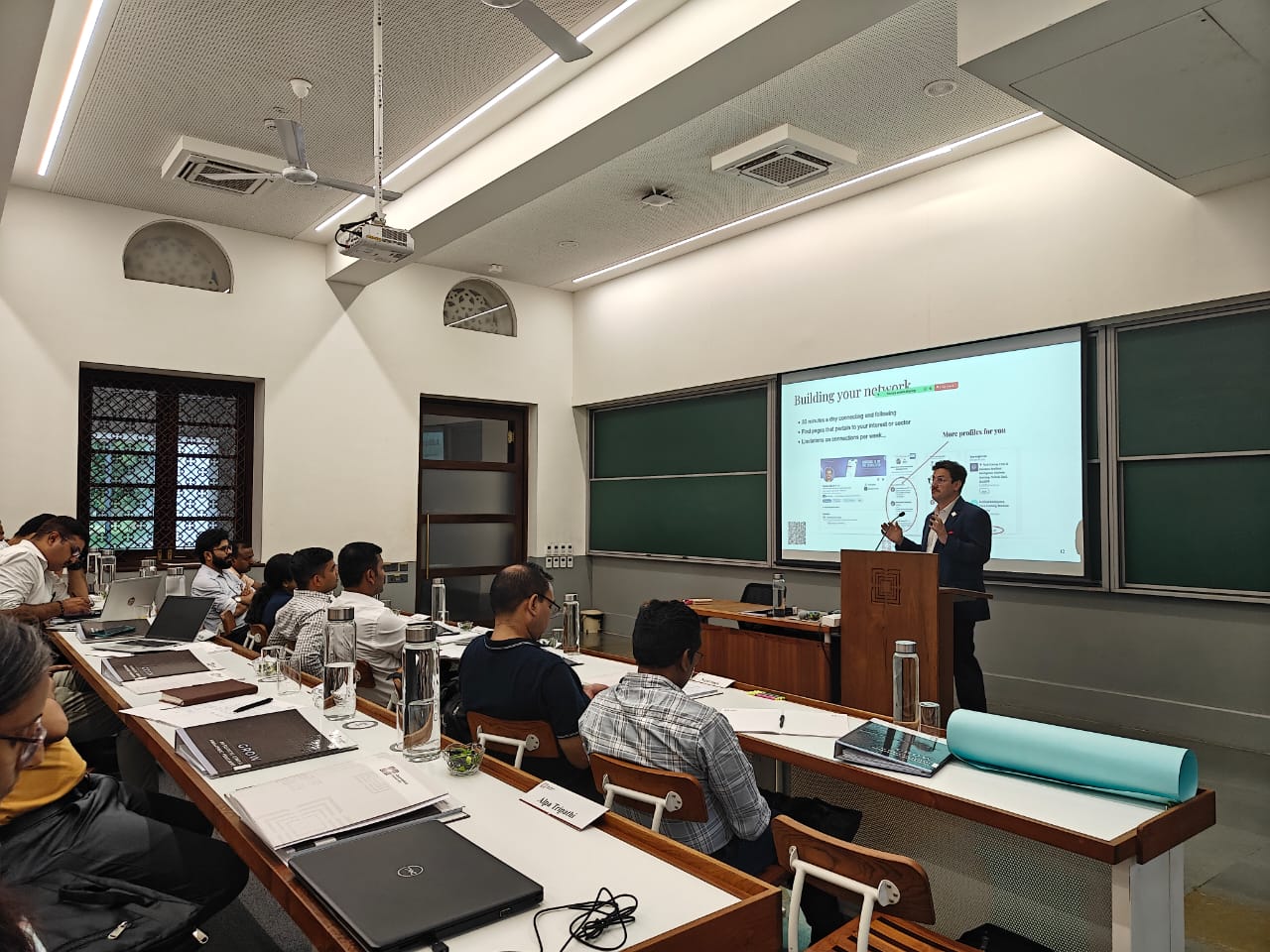 Jeremy Fritzhand leading a masterclass at a podium in front of a classroom