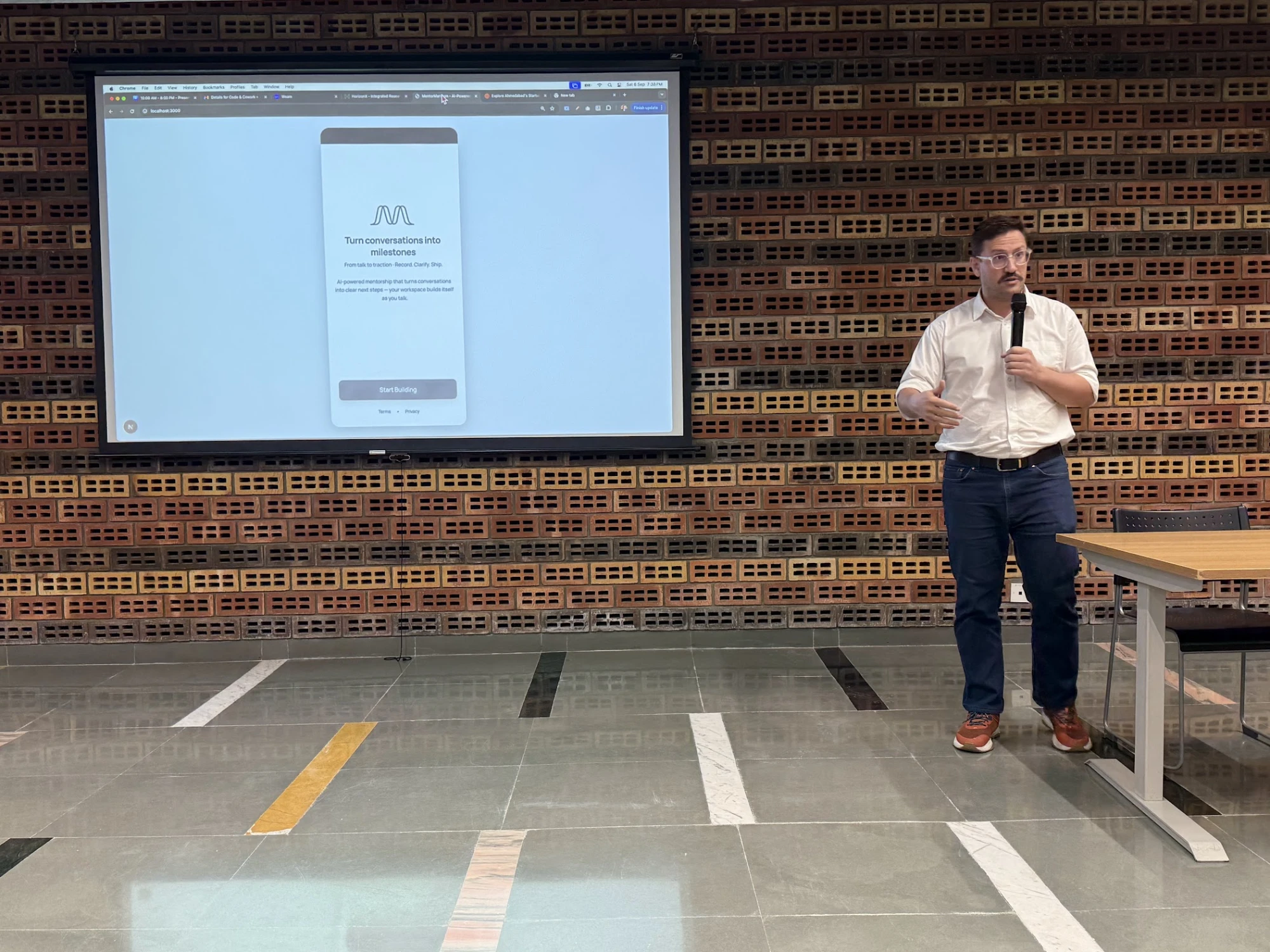 Jeremy Fritzhand presenting a live product on screen to an audience