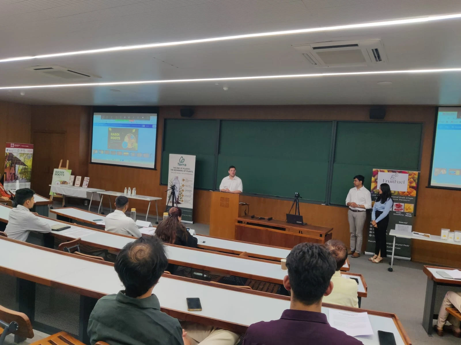 Jeremy Fritzhand hosting a startup demo day in a lecture hall